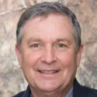 Portrait of a confident older man smiling during a casual interview